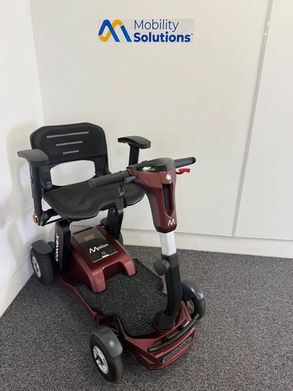 Mobility scooter with 'Mobility Solutions' logo on a gray floor.