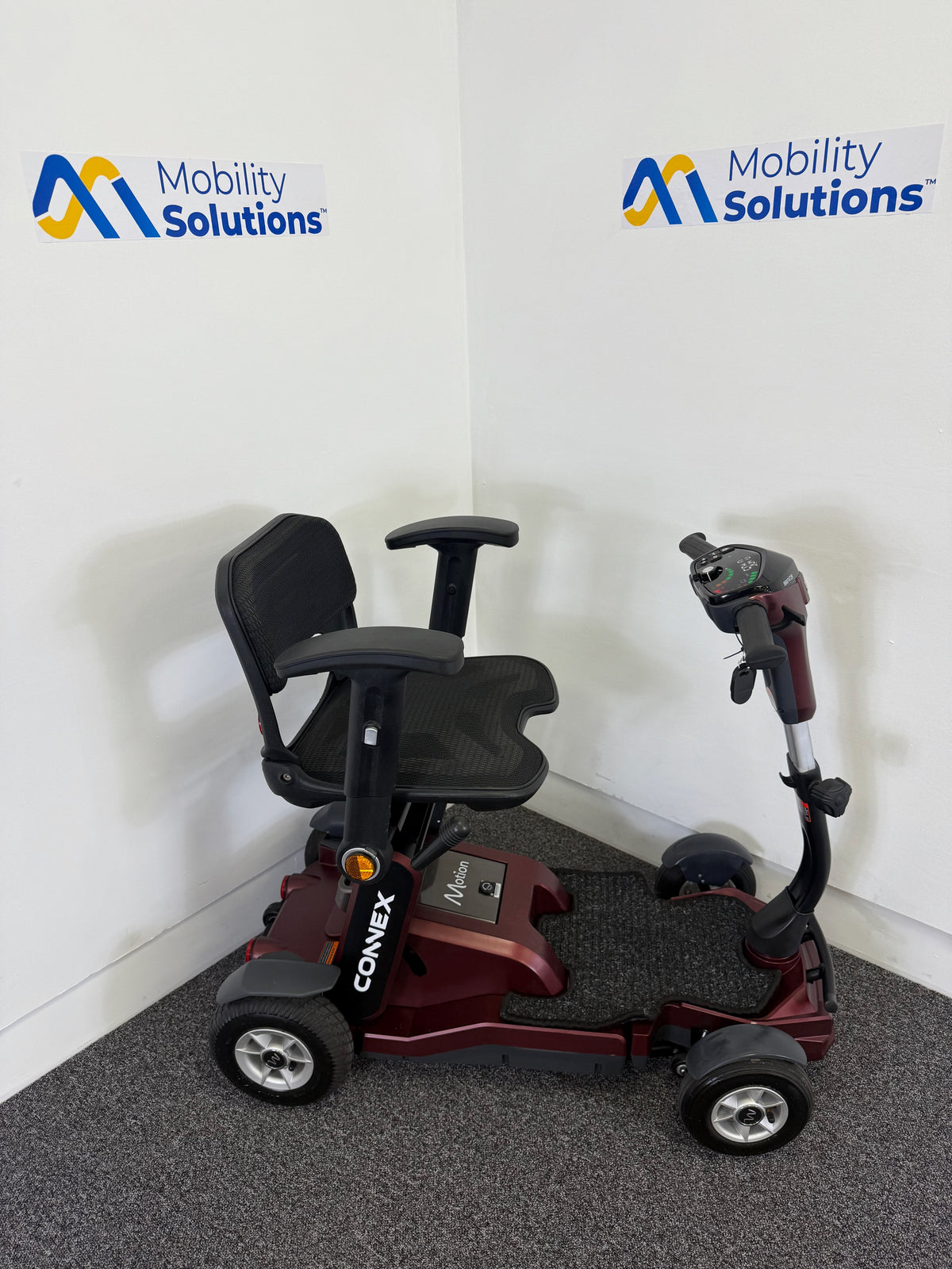 Mobility scooter with 'Mobility Solutions' logo on a white background